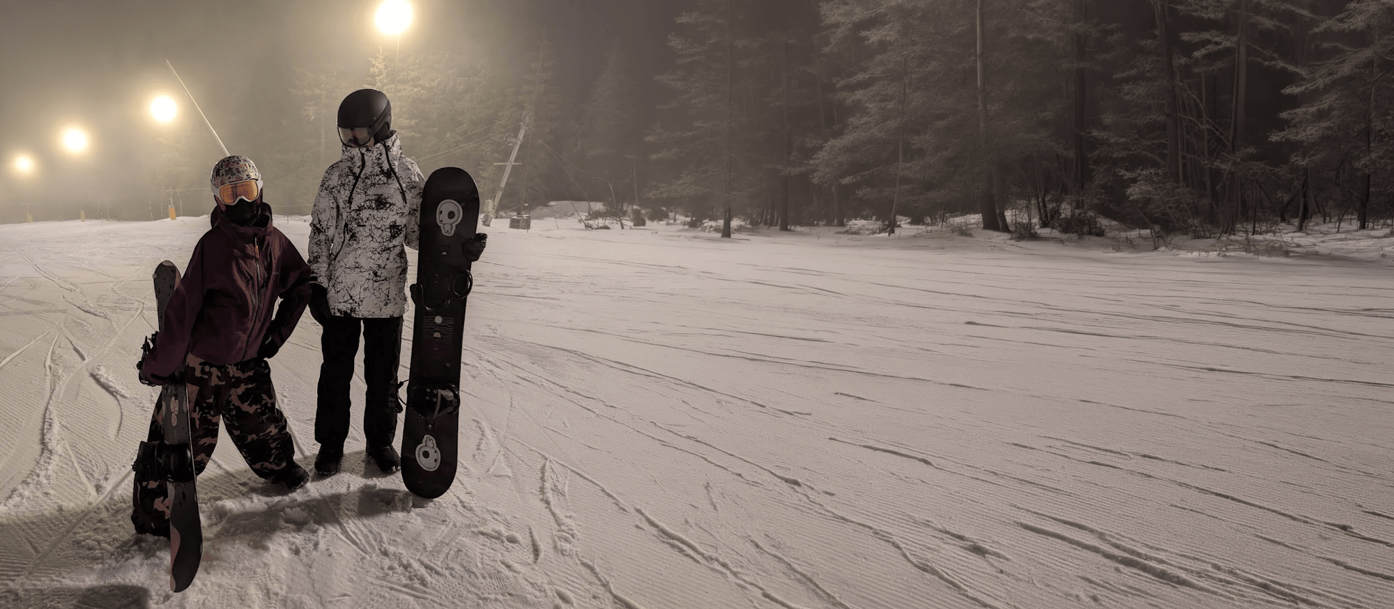 Jakub Dlugolecki snowboarding with his daughter
